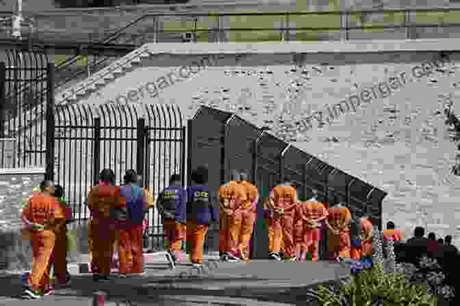 A Group Of Inmates In A Prison Yard, Looking Towards A Distant Hope Hard Time: Image Orlando Ribeiro