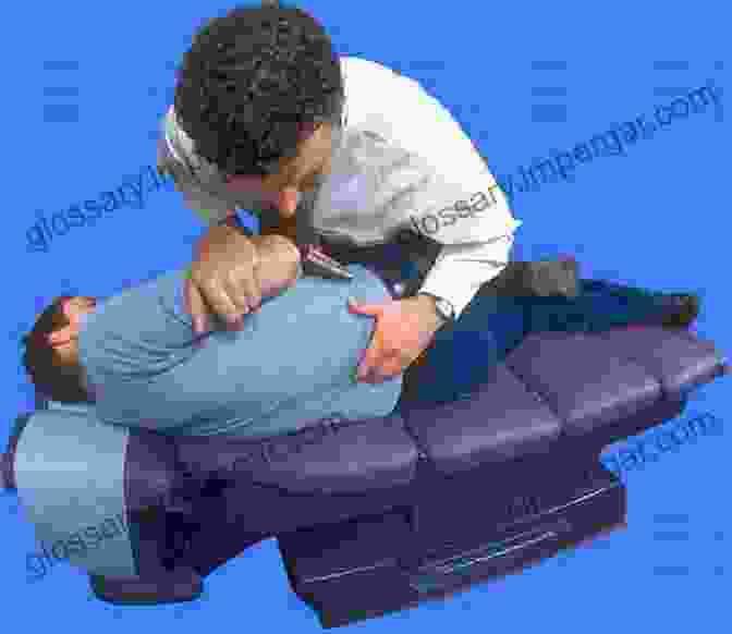 A Physical Therapist Demonstrates A Joint Mobilization Technique On A Patient With Spinal Pain Freedom To Move: Movement Therapy For Spinal Pain And Injuries